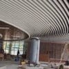 Close-up view of New Design Aluminum Strips Ceiling in a commercial setting.