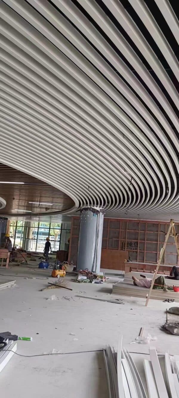 Close-up view of New Design Aluminum Strips Ceiling in a commercial setting.